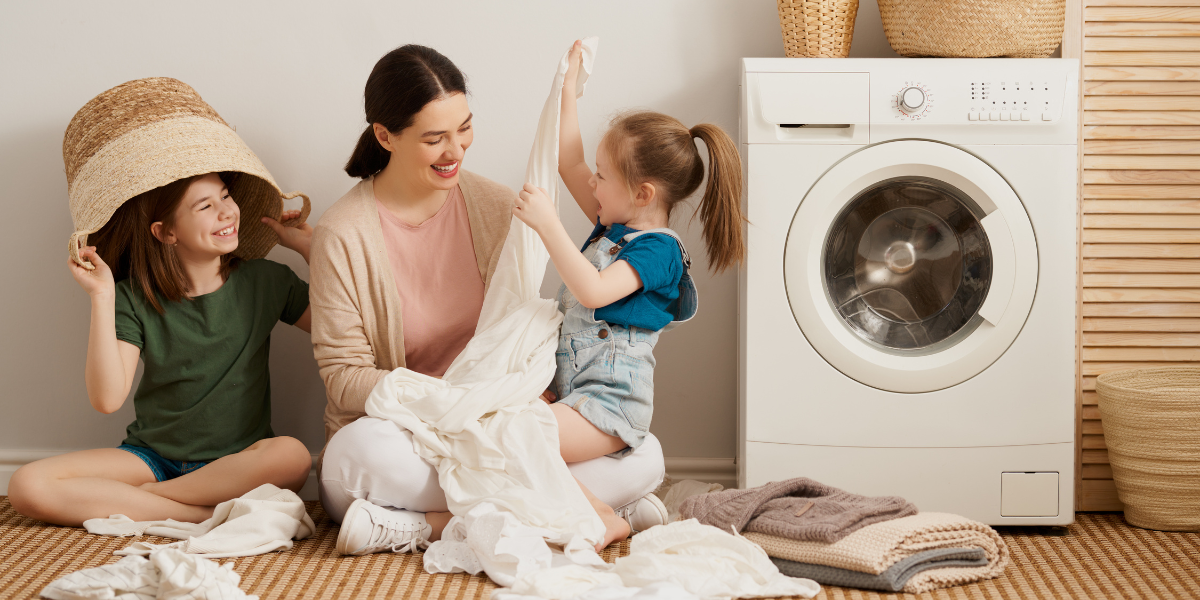 a family doing laundry together