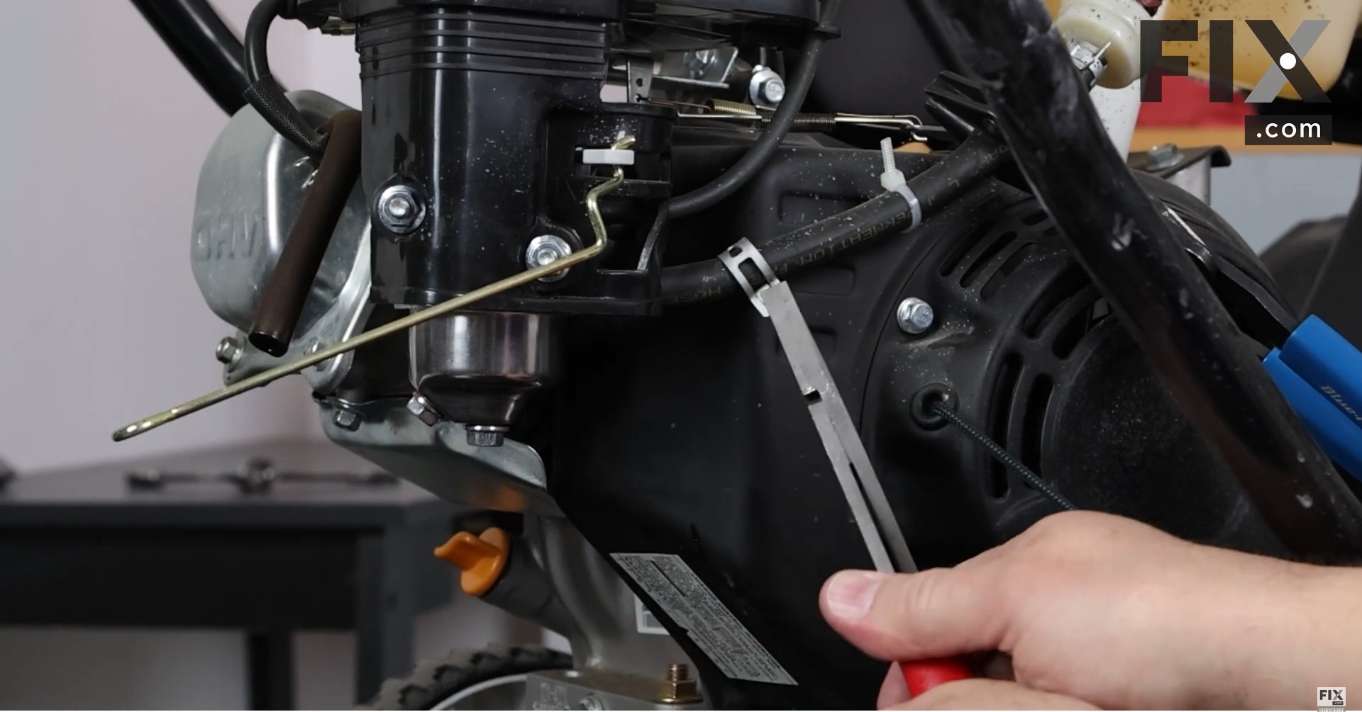 Removing the Hose Clamp from a Single Stage Snowblower