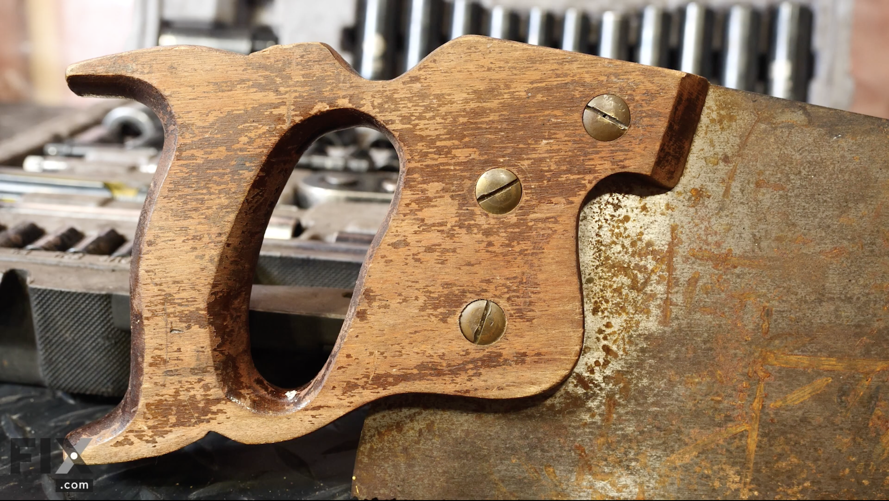 Old hand saw handle covered in rust, dirt and grime ready for a clean and complete restoration with a sanding and oil.