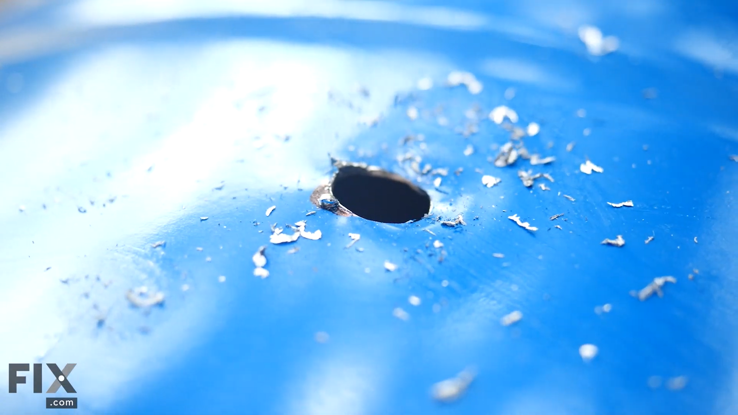 Hole drilled into a metal surface.