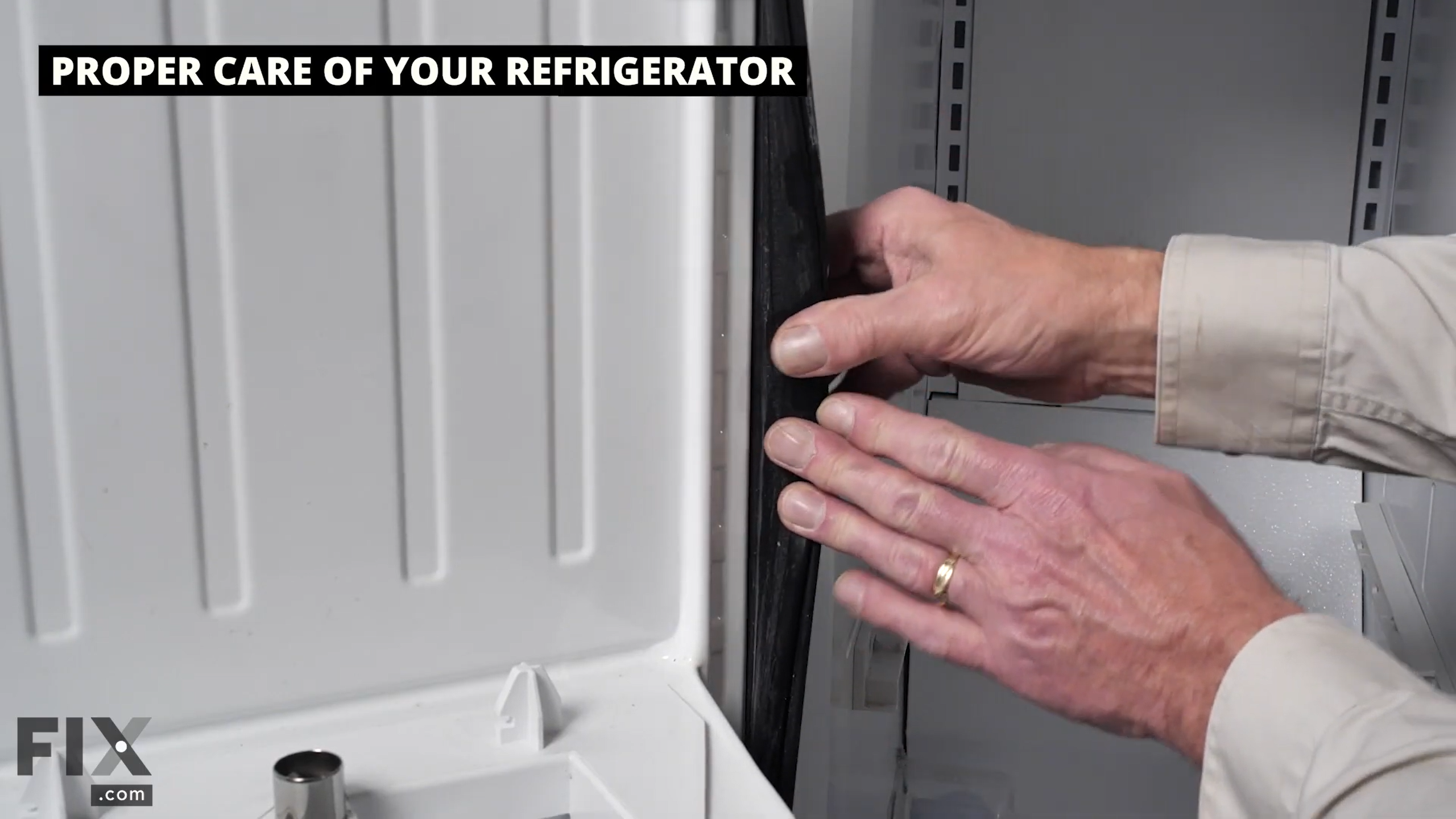 Interior fridge door gasket seal being stretched for cracks or damage.