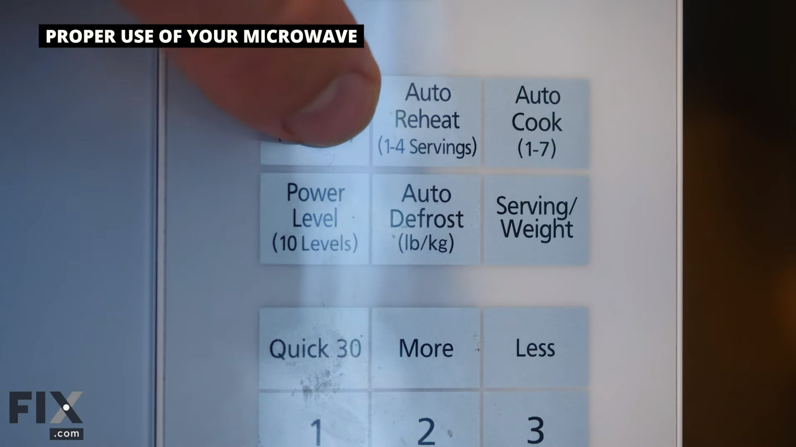 Finger touching a white touchpad menu of a white microwave.